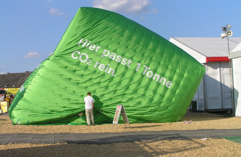  This cube is representing the Volume of one ton of carbon dioxide. The picture was taken on the ''Hessentag'' 2009 in Langenselbold, Hesse while the cube was dismounted.  (credit: WIKIMEDIA)