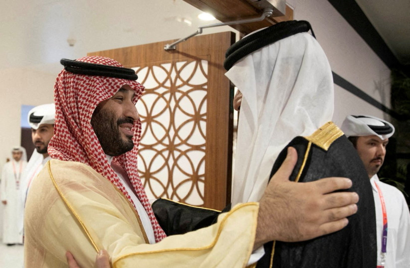  Saudi Arabia Crown Prince and Prime Minister Mohammed bin Salman is received by Qatari Emir Sheikh Tamim bin Hamad al-Thani on the sidelines of the World Cup in Doha, Qatar, November 20, 2022 (photo credit: VIA REUTERS)