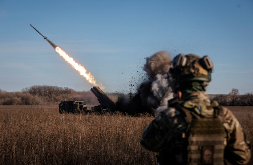 Ukrainian servicemen fire with a Bureviy multiple launch rocket system at a position in Donetsk region, as Russia's attack on Ukraine continues, Ukraine, November 29, 2022. (photo credit: RADIO FREE EUROPE/RADIO LIBERTY/SERHII NUZHNENKO VIA REUTERS)