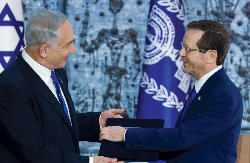  Likud head MK Benjamin Netanyahu is seen receiving the mandate to form Israel's next government from Israeli President Isaac Herzog. (credit: MARC ISRAEL SELLEM)
