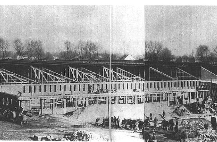  The munitions factory in Auschwitz under construction. (credit: PIPER/JACOB SIVAK)