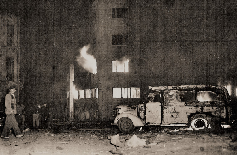  THE ORIGINAL ‘Palestine Post’ office goes up in flames after a half-ton bomb went off outside the building on Hasolel Street (now Havatzelet Street), February 1, 1948. Three employees were killed and many were wounded. (credit: Werner Braun/ Jerusalem Post archives)