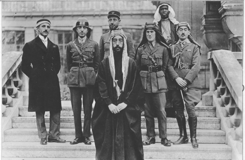  KING FAISAL of the Hashemite Arab Kingdom (front) with T. E. Lawrence (2nd R) and the Hejazi delegation at the post-World War I Paris Peace Conference, 1919. (photo credit: Wikimedia Commons)