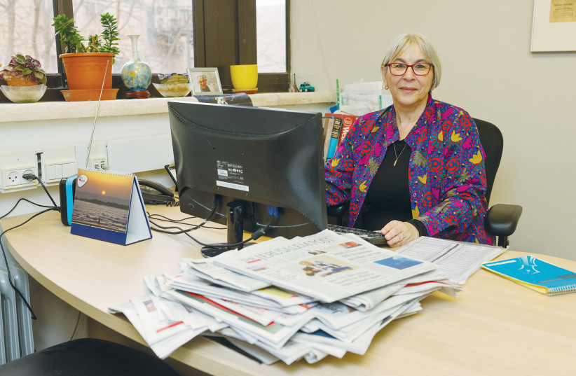  THE WRITER works in her ‘Jerusalem Post’ office, amid evidence of being a print journalist.  (photo credit: Marc Israel Sellem/Jerusalem Post)