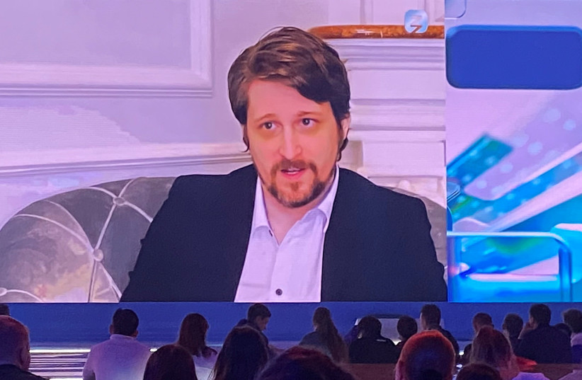  Former contractor of US National Security Agency Edward Snowden is seen on a screen during his interview presented via video link at the New Knowledge educational online forum in Moscow, Russia on September 2, 2021 (photo credit: OLESYA ASTAKHOVA/REUTERS)