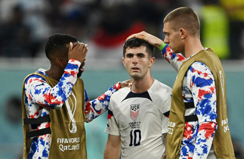  Soccer Football - FIFA World Cup Qatar 2022 - Round of 16 - Netherlands v United States - Khalifa International Stadium, Doha, Qatar - December 3, 2022 Christian Pulisic, Kellyn Acosta and Ethan Horvath of the U.S. look dejected after the match as United States are eliminated from the World Cup  (photo credit: REUTERS/DYLAN MARTINEZ)