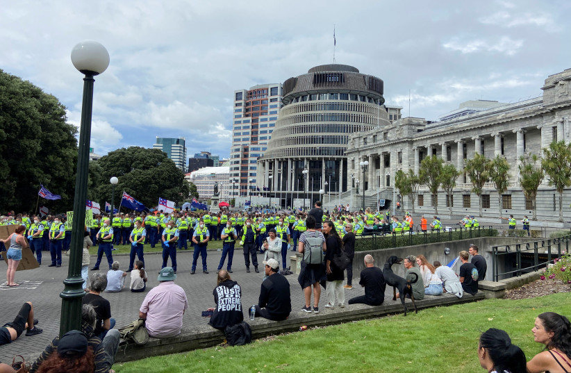  Anti-vaccine mandate protesters gather to demonstrate in front of the parliament in Wellington, New Zealand, February 10, 2022. (credit: REUTERS)