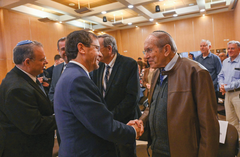  PRESIDENT ISAAC HERZOG and World Zionist Organization Chairman Yaakov Hagoel (left) shake hands with participants at the commemoration ceremony marking the 75th anniversary of the UN resolution on the partition of Palestine.  (photo credit: KOBI GIDON / GPO)
