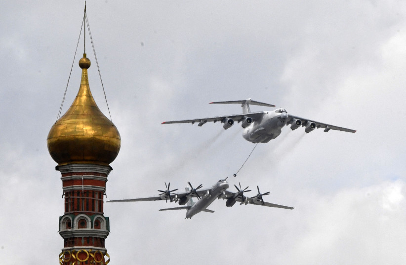  A Russian Tu-95MS strategic bomber and an Ilyushin Il-78 aerial refueling tanker fly over the Kremlin and Red Square in Moscow on May 7, 2021 (photo credit: ALEXANDER NEMENOV/AFP via Getty Images)