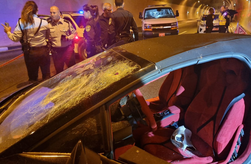  The car that was shot at injuring two east Jerusalem residents around midnight on December 6 on Highway 6 near Ben Shemen Junction.  (photo credit: ISRAEL POLICE)