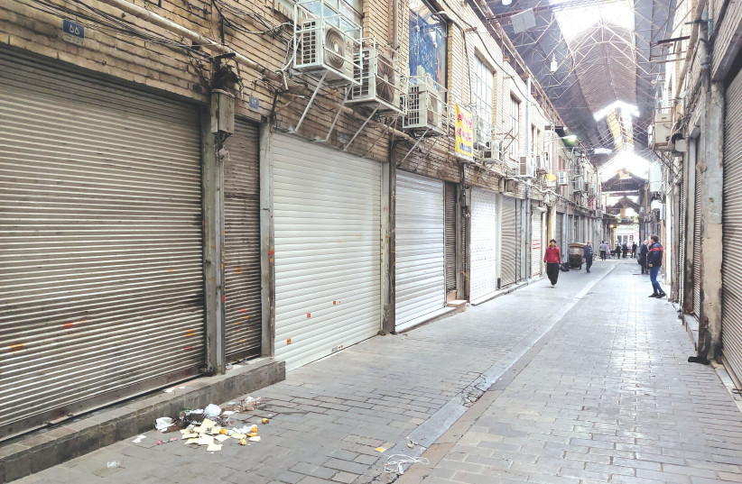  SHOPS ARE closed following riots and the call of protesters to close the markets, in Tehran, last month. Anger has shifted to the markets, which are considered the backbone of the economy, says the writer.  (credit: WEST ASIA NEWS AGENCY/REUTERS)