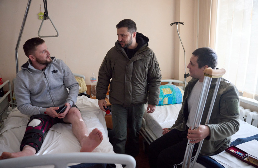  Ukraine's President Volodymyr Zelensky visits service members at a hospital on the Day of the Ukrainian Armed Forces, amid Russia's attack on Ukraine, in Kharkiv, Ukraine December 6, 2022. (credit: Ukrainian Presidential Press Service/Handout via REUTERS)