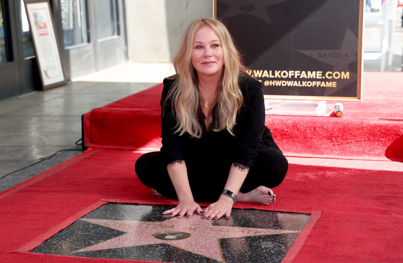 Christina Applegate poses with her star during her Hollywood Walk of Fame Ceremony at Hollywood Walk Of Fame on November 14, 2022 in Los Angeles, California. (photo credit: PHILLIP FARAONE/GETTY IMAGES)