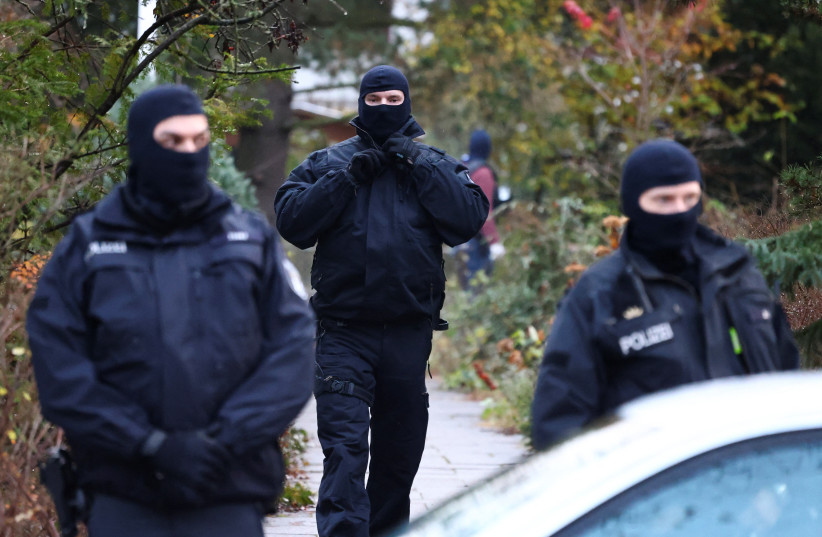  Police secures the area after 25 suspected members and supporters of a far-right group were detained during raids across Germany, in Berlin, Germany December 7, 2022. (photo credit: REUTERS/CHRISTIAN MANG)
