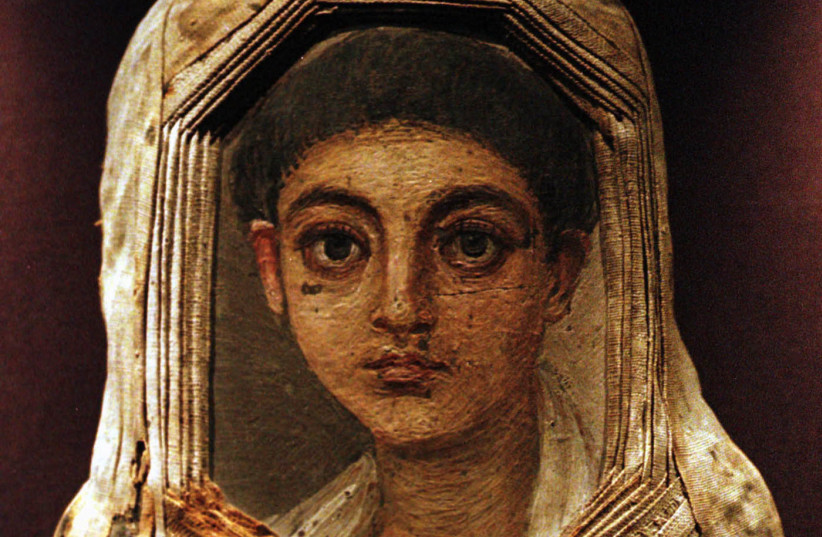 The mummy of an Egyptian boy, boasting a Fayoum portrait as a burial mask, is shown in an exhibit at the Benaki Museum in Athens June 25. About 1,000 portraits found in Egypt's Fayoum desert and long ignored as cultural misfits, are now touted as the missing link between ancient and medieval painti (credit: REUTERS)