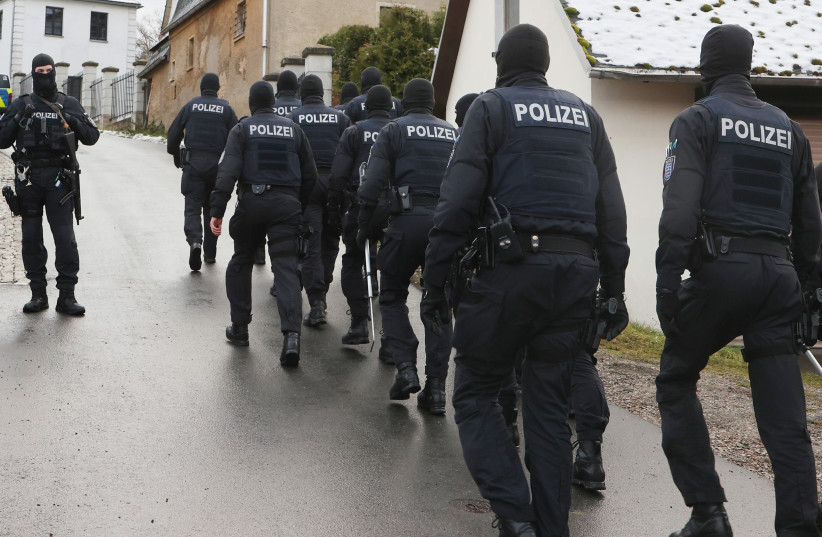 Police perform a raid on suspected members of the Reichsbürger far-right group in Saaldorf, Germany, Dec. 7, 2022. (photo credit: BODO SCHACKOW/PICTURE ALLIANCE VIA GETTY IMAGES)
