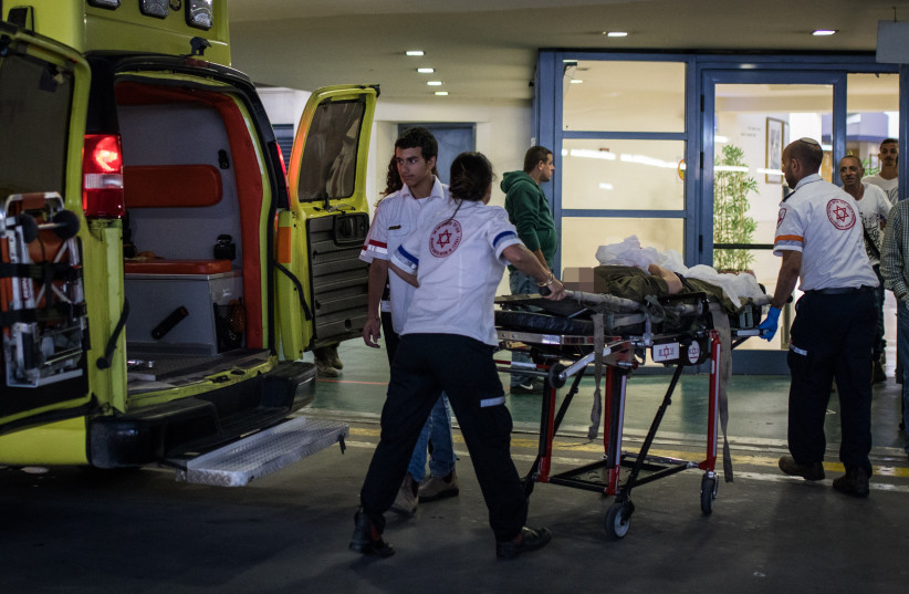  A wounded Israeli man is evauated at the Beilinson hospital, in Petah Tikva, March 17, 2019 (credit: FLASH90)