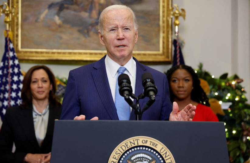  US President Joe Biden speaks to reporters about the release of WNBA basketball star Brittney Griner by Russia, as Vice President Kamala Harris and Cherelle Griner listen, in the Roosevelt Room at the White House in Washington, U.S. December 8, 2022 (photo credit: REUTERS/JONATHAN ERNST)