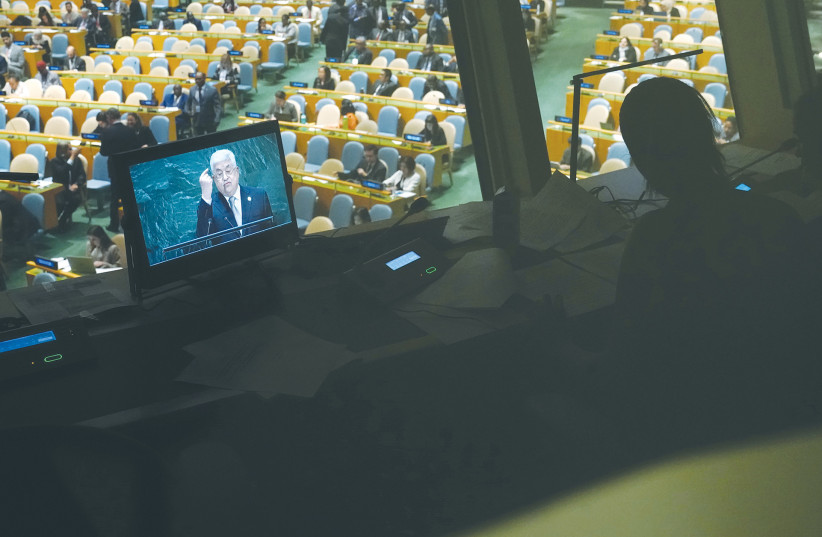 A TRANSLATOR works as Palestinian Authority head Mahmoud Abbas addresses the United Nations General Assembly in New York in September 2019.  (photo credit: CARLO ALLEGRI/REUTERS)