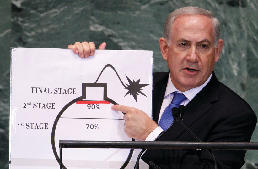  THEN-PRIME Minister Benjamin Netanyahu points to a red line he drew on the graphic of a bomb used to represent Iran’s nuclear program as he addresses the 67th United Nations General Assembly at the UN in New York, in 2012. (photo credit: LUCAS JACKSON/REUTERS)