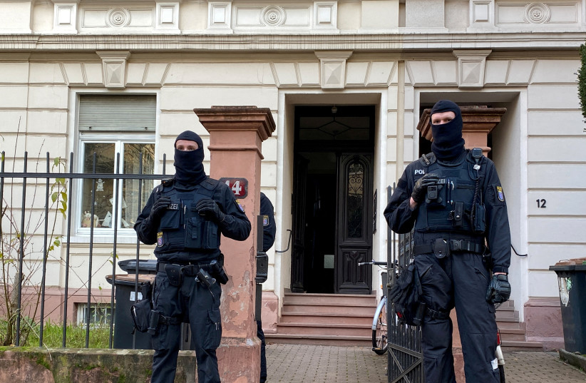  Police secures the area after 25 suspected members and supporters of a far-right group, that the interior ministry claimed posed a terrorist threat, were detained during raids across Germany, in Frankfurt, Germany December 7, 2022. (photo credit: TILMAN BLASSHOFER / REUTERS)