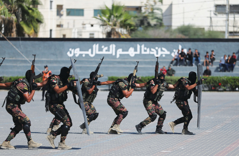  PALESTINIAN POLICE loyal to Hamas perform a demonstration during a graduation ceremony in Gaza City in October. (credit: IBRAHEEM ABU MUSTAFA/REUTERS)