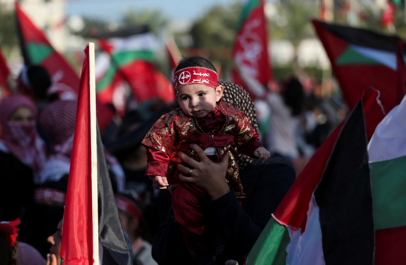  Palestinians take part in a rally of the Popular Front for the Liberation of Palestine (PFLP) on the 55th anniversary of the founding of (PFLP), in Gaza City, December 8, 2022.  (credit: REUTERS/IBRAHEEM ABU MUSTAFA)