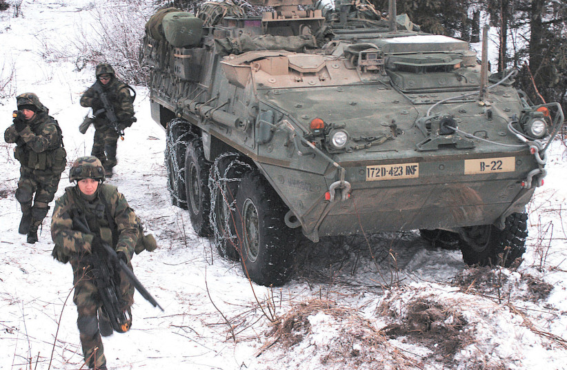  Soldiers from Company B, 4th Battalion, 23rd Infantry Regiment, 172nd Stryker Brigade Combat Team, U.S. Army Pacific, move into position for the first-ever live fire exercise with Strykers at Fort Richardson, Alaska. (credit: WIKIMEDIA)