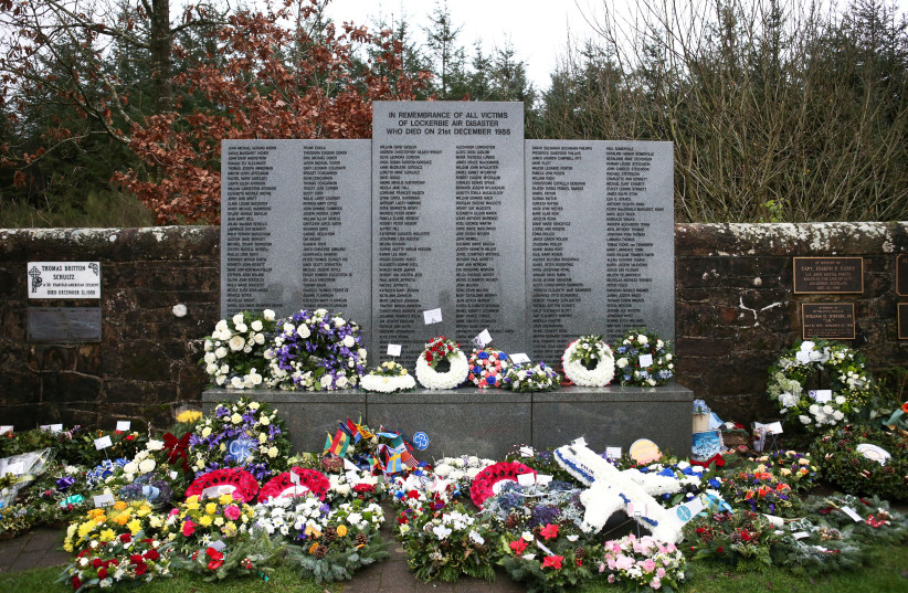  Floral tributes left at the Memorial Garden in Dryfesdale Cemetery, are seen on the morning of the 30th anniversary of the bombing of Pan Am flight 103 which exploded over the Scottish town on December 21, 1988, killing 259 passengers and crew and 11 residents on the ground, in Lockerbie, Scotland. (credit: JANE BARLOW/POOL VIA REUTERS/FILE PHOTO)