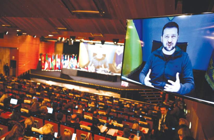  UKRAINIAN PRESIDENT Volodymyr Zelensky speaks via video to the Annual Session of the NATO Parliamentary Assembly in Madrid last month. (credit: Juan Medina/Reuters)