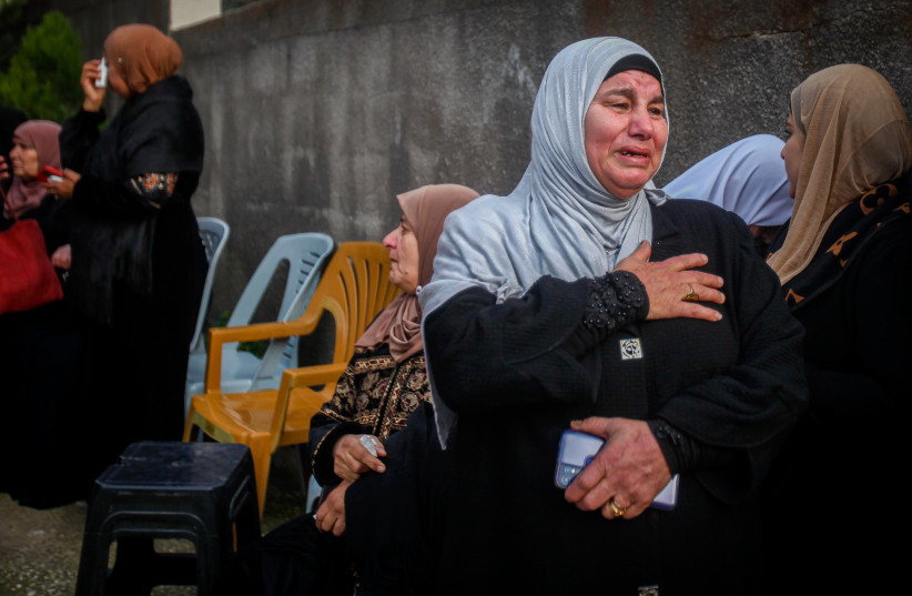 Palestinian gunmen and mourners attend the funeral of 16-year-old Palestinian Jana Zakarneh, killed during an Israeli army raid, in the West Bank city Jenin, December 12, 2022.  (credit: NASSER ISHTAYEH/FLASH90)