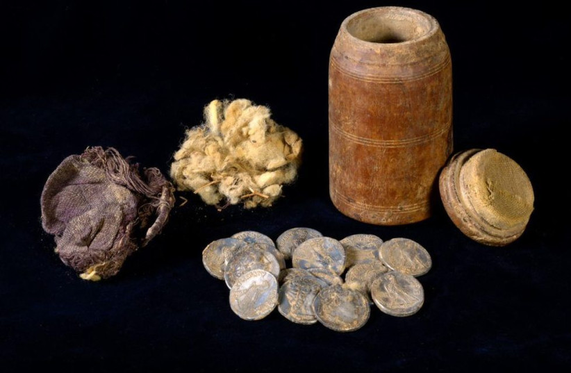  The wooden box containing 15 silver coins from the Maccabean period was discovered in the Judean Desert earlier in 2022. (credit: DAFNA GAZIT/ISRAEL ANTIQUITIES AUTHORITY)