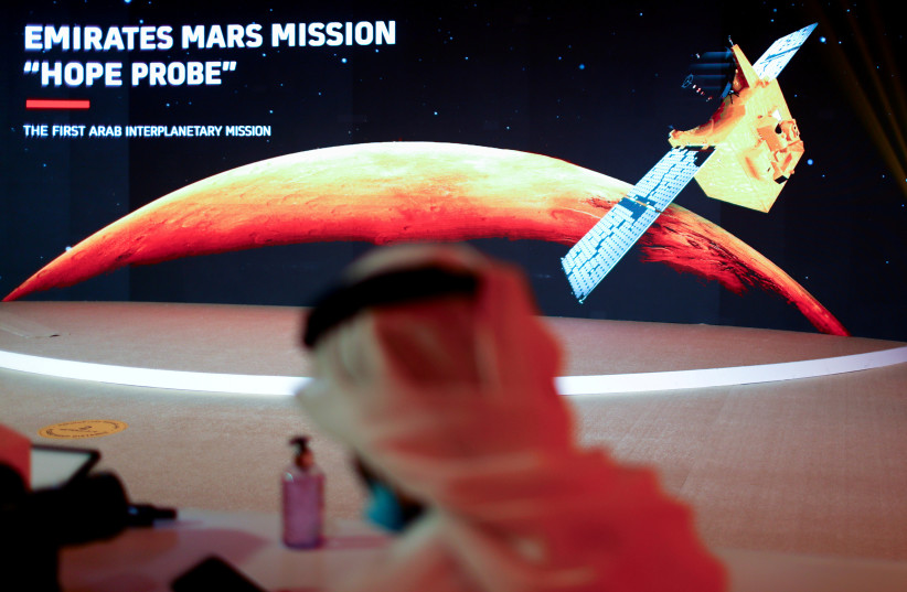  A representation of Mars and the Hope Probe is seen at the Mohammed bin Rashid Space Centre ahead of its launch from Tanegashima Island in Japan, in Dubai, United Arab Emirates July 19, 2020.  (photo credit: REUTERS/AHMED JADALLAH)