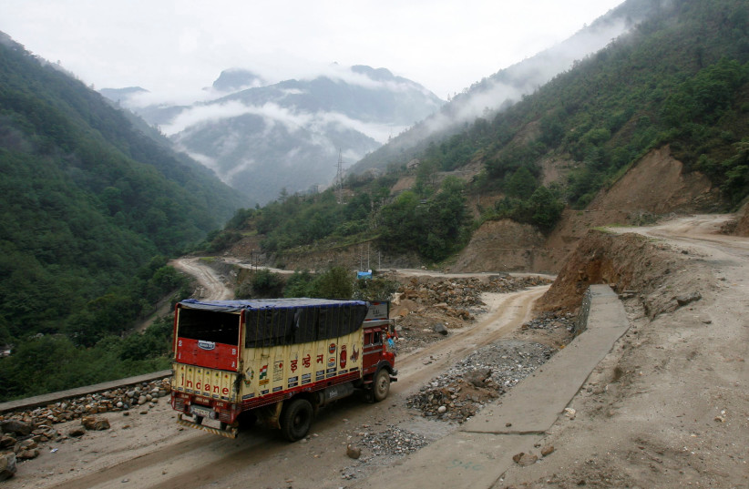 A liquefied petroleum gas (LPG) delivery truck drives along India's Tezpur-Tawang highway which runs to the Chinese border, in the northeastern Indian state of Arunachal Pradesh, May 29, 2012. (credit: REUTERS)