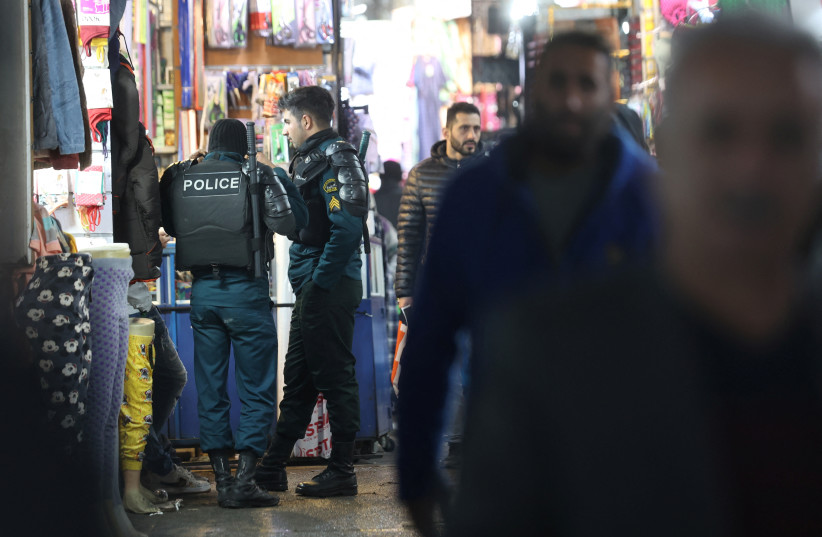  Iran's riot police forces stand in Tehran Bazaar, in Tehran, Iran December 5, 2022.  (credit: MAJID ASGARIPOUR/WANA/REUTERS)