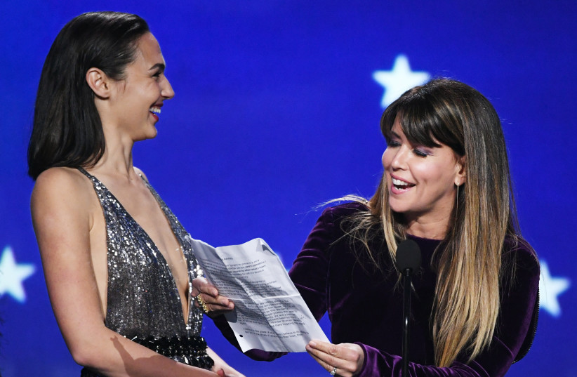  Actor Gal Gadot (L) and director Patty Jenkins accept Best Action Movie for 'Wonder Woman' onstage during The 23rd Annual Critics' Choice Awards at Barker Hangar on January 11, 2018 in Santa Monica, California. (photo credit: KEVIN WINTER/GETTY IMAGES)