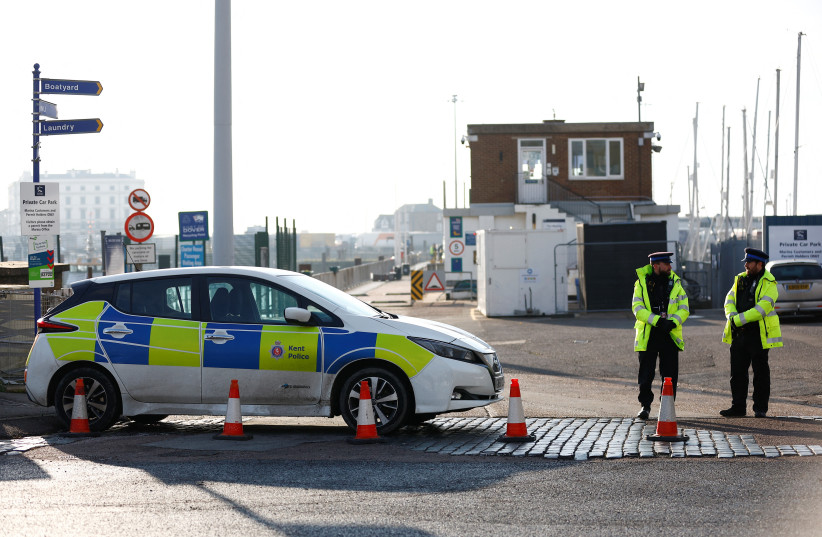  Police officers gather at the Port of Dover amid a rescue operation of a missing migrant boat, in Dover, Britain December 14, 2022. (photo credit: PETER NICHOLLS/REUTERS)
