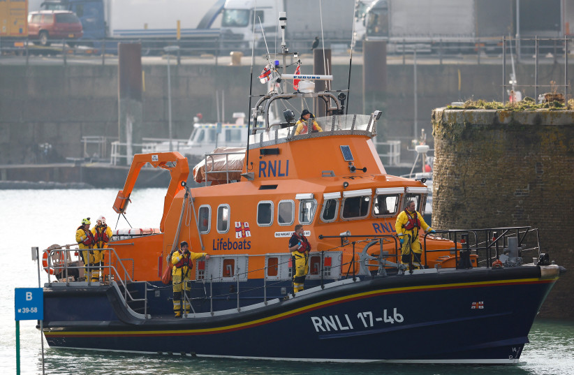  A life boat returns to the Port of Dover amid a rescue operation of a missing migrant boat, in Dover, Britain December 14, 2022.  (credit: PETER NICHOLLS/REUTERS)