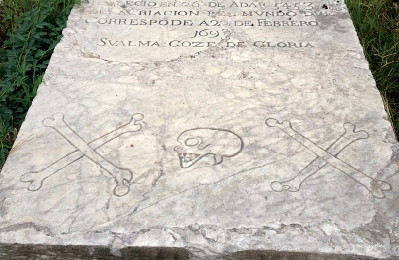  Sephardi tombstones in the Hunt’s Bay Cemetery in Jamaica are adorned with skulls and crossbones.  (photo credit: MAAYAN JAFFE-HOFFMAN)