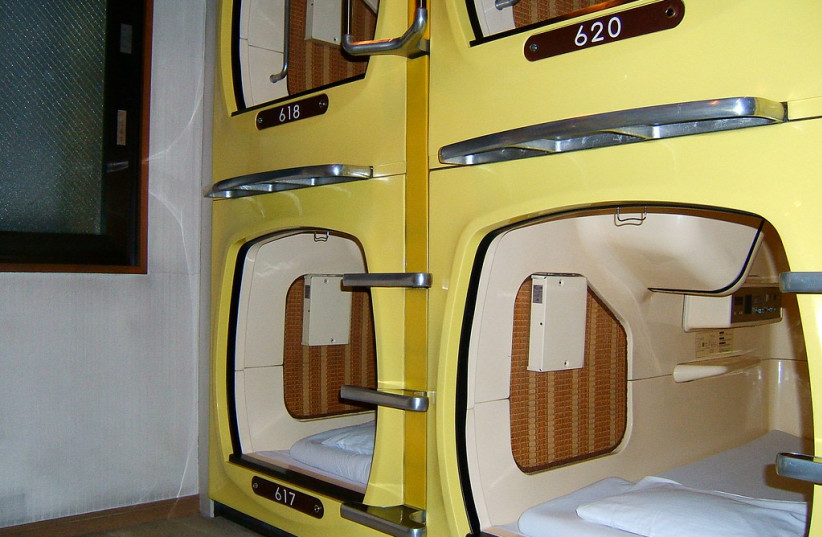  Capsules in a capsule hotel. (photo credit: FLICKR)