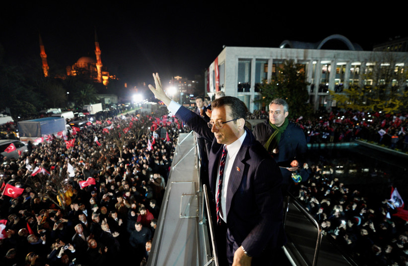  Istanbul Mayor Ekrem Imamoglu greets his supporters as they gather in front of his office as a Turkish court sentenced Imamoglu to more than two years in prison and imposed a political ban for insulting public officials, in Istanbul, Turkey December 14, 2022. (photo credit: REUTERS)