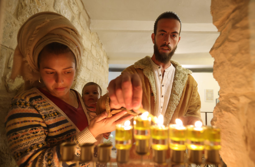  LIGHTING THE ‘hanukkiah’ should be a transforming act.  (photo credit: David Cohen/Flash90)