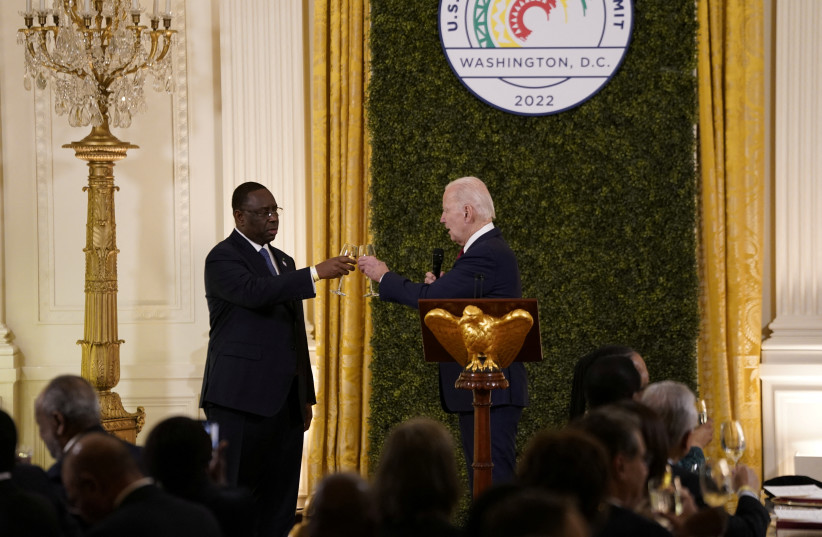  U.S. President Joe Biden and Senegal's President and Chairperson of the African Union Macky Sall raise a toast during the U.S.-Africa Leaders Summit dinner in the East Room at the White House in Washington, U.S., December 14, 2022. (credit: REUTERS/ELIZABETH FRANTZ)