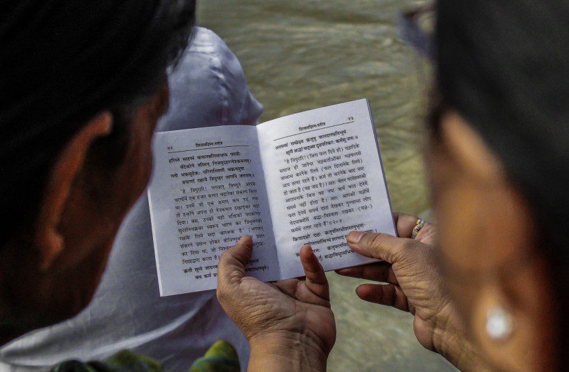  woman reading sanskrit (photo credit: WIKIMEDIA)