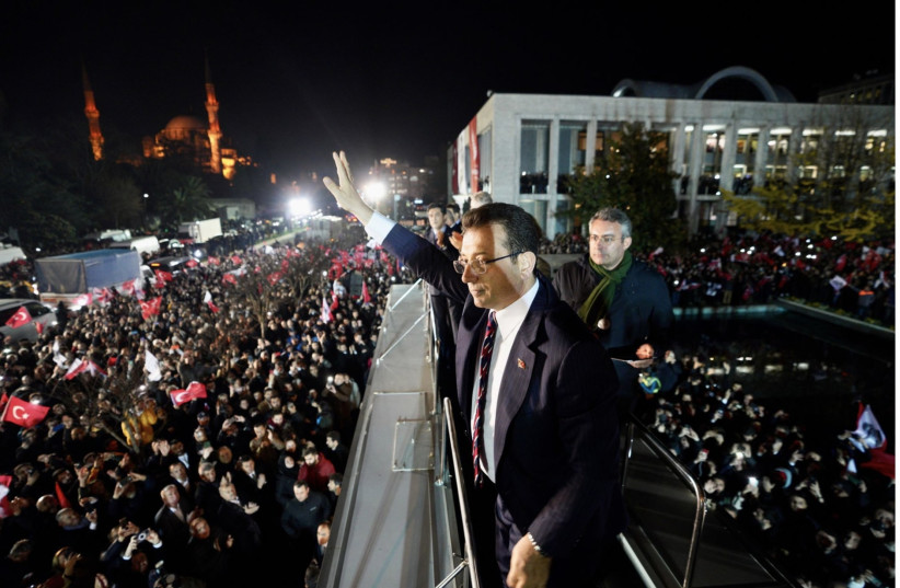  Istanbul Mayor Ekrem Imamoglu waves to supporters gathered in front of Istanbul Metropolitan Municipality during a protest in Istanbul on December 14, 2022 after a Turkish court sentenced him to nearly three years jail for insulting public officials. (photo credit: Istanbul Metropolitan Municipality)