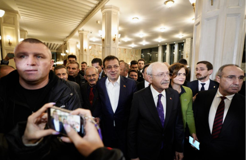  Mayor Ekrem Imamoglu, center, flanked by Kemal Kilicdaroglu, the leader The Republic People’s Party (CHP) (blue tie) seen in Istanbul on December 14, 2022, hours after a Turkish court sentenced him to nearly three years jail for insulting public officials. (credit: Istanbul Metropolitan Municipality)