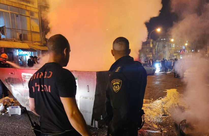  Israel Police officers survey the damage after heavy rioting from ultra-Orthodox protesters in central Jerusalem, December 15, 2022. (photo credit: ISRAEL POLICE SPOKESMAN)