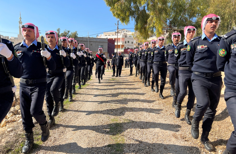  Jordanian security personnel attend the funeral of senior police officer who was killed in riots on Thursday night according to authorities (photo credit: REUTERS)
