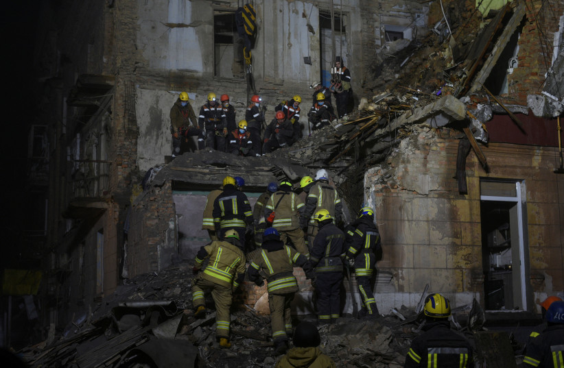  Rescuers work at the site of a residential building damaged by a Russian missile, amid Russia's attack on Ukraine, in Kryvyi Rih, Ukraine December 16, 2022 (photo credit: REUTERS/MYKOLA SYNELNYKOV)