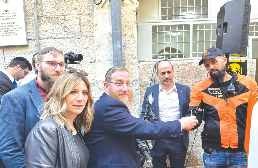  ELI KAY’S family meets Yoni Ben Shimol (right) at the dedication ceremony in Eli’s memory.  (credit: UNITED HATZALAH‏)